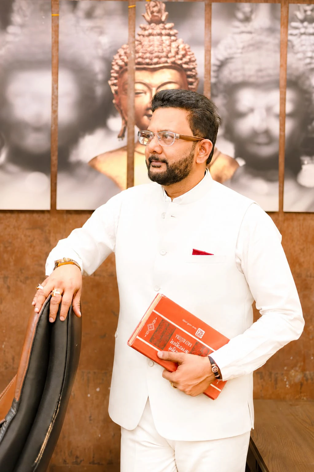 Authentic portrait of Dr. Ashish Patni reflecting with a book